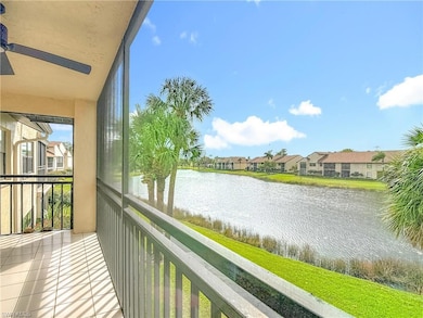 Balcony featuring a water view, a sunroom, a ceiling fan, and a residential view