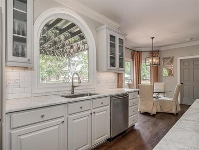 Large window overlooking the backyard and plenty o