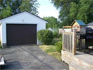 Parking Lot/Garage. View of Garage,yard and deck. 