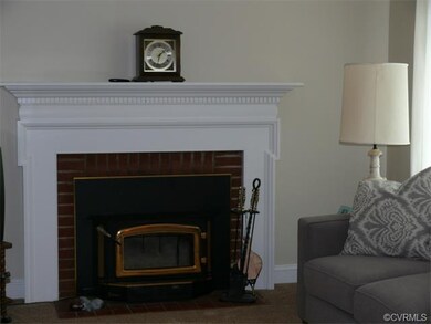 Brick wood burning fireplace with blower.