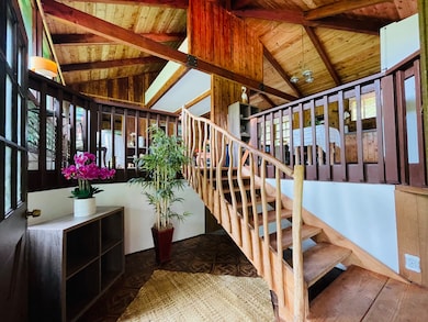 Beautiful entryway featuring custom architecture.