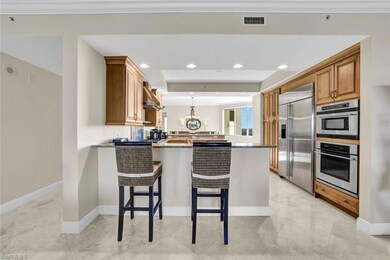 Kitchen featuring kitchen peninsula, appliances wi