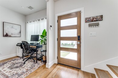 Office area with wood finished floors and baseboards