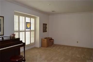 Opposite the dining room, the formal living room c
