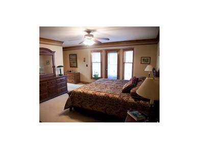 Elegant, Large Master Bedroom.  Exits Onto Rear De