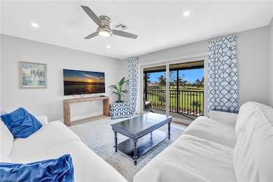 Living area with recessed lighting, wood finished floors, and ceiling fan