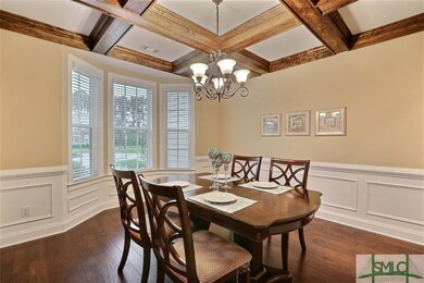 Formal dining room complete with handscarped hardw