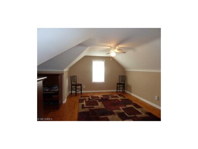 Second Floor Bedroom updates include built in closet cabinets shoe rack, and garment hanging section, two-tone neutral wall color paint, lighted ceiling paddle fan, hardwood flooring
