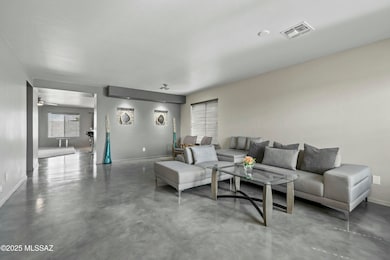 Living room, concrete floor throughout