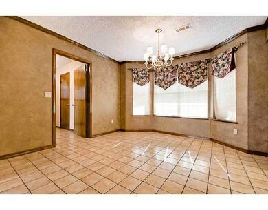Kitchen. Breakfast area features bay window and tile floors