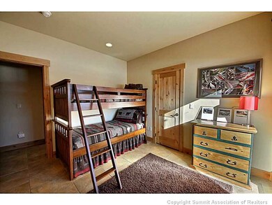 Bedroom. Lower Level Bunk Room...with the stone fl