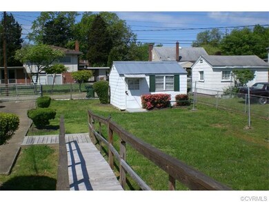 View of large storage shed and parking area.  Rear