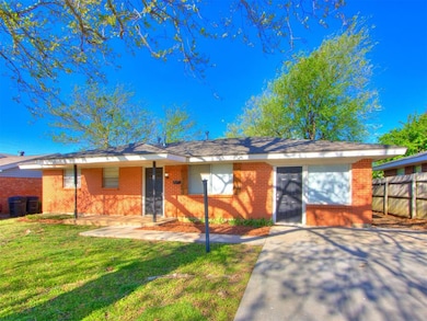 Ranch-style house featuring a front yard, fence, a