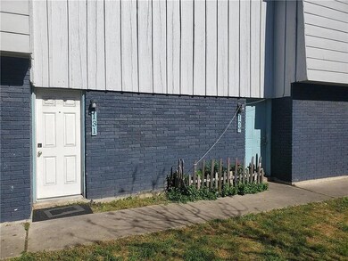 View of side of home with brick siding