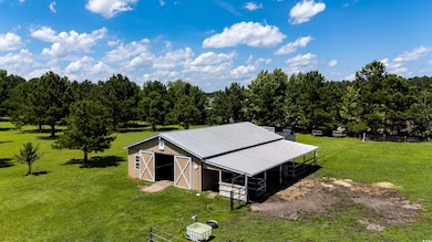View of outbuilding with an exterior structure