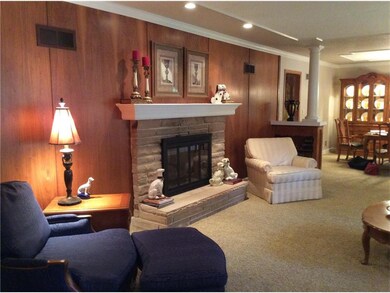 Fireplace in living room. See thru to hearth room.