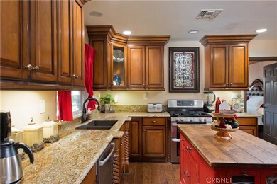 Remodeled kitchen with newer appliances.