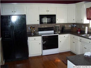 Tons of counter space and cabinets, ceramic back s