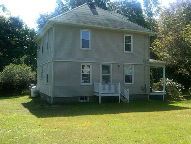 Entry. Side entry leads to second floor apartment
