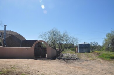 front of home with 5000 gallon water sto