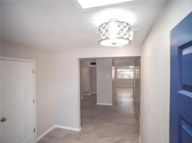 Beautiful foyer with brand new light fix