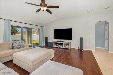 Living room with vaulted ceiling, wood finished fl