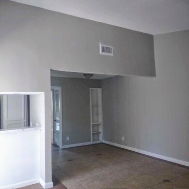 Spare room featuring baseboards and visible vents