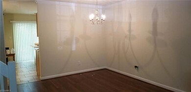 The dining room area is located next to the kitchen and living room areas. Most of the walls in the townhome have just been painted stylish gray and the remainder of the walls will be painted after the tenant moves out and before the home closes.