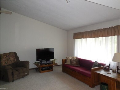 Living Room with vaulted ceilings opens to the Din