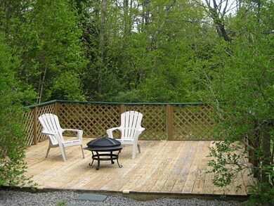 Back Yard. Expansive deck nestled...