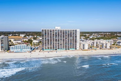 Aerial view featuring a beach view and a water vie