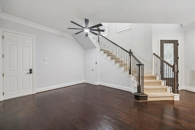 The dining room has enough space for a large formal table with added under-stair storage.