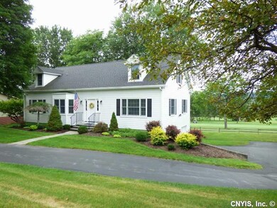 Exterior Front. Wrap around driveway leads you to 