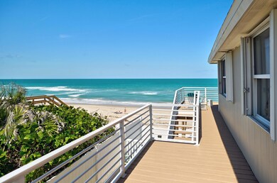 Side balcony with stairs to sand