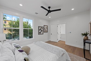 Bedroom with visible vents, recessed lighting, an