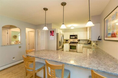Kitchen opens up to den and living room.
