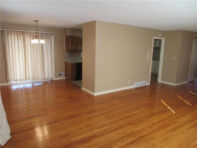 The dining room is just off the living room and kitchen making entertaining a breeze! The slider in the dining room opens out to the fenced backyard and patio.