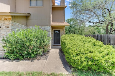 Doorway to property with stone siding