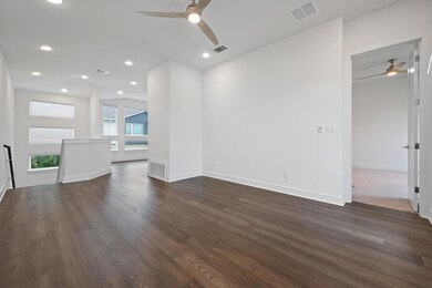 Unfurnished living room featuring ceiling fan, da