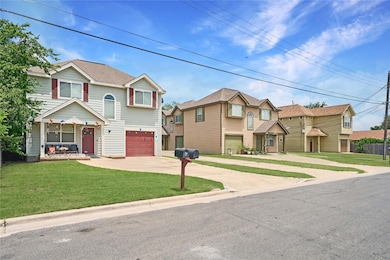 Multi unit property featuring concrete driveway, 