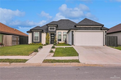 View of front of property featuring a shingled roof, driveway, and a garage