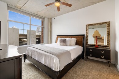 Primary bedroom large windows provide natural ligh