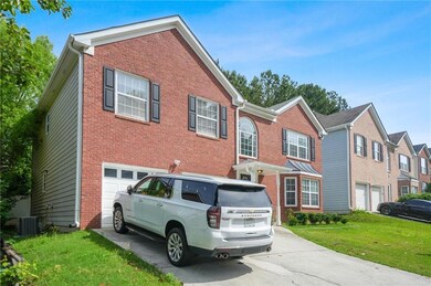 View of front of house featuring a garage, drivewa