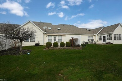 Rear view of house with a patio, central AC unit, 