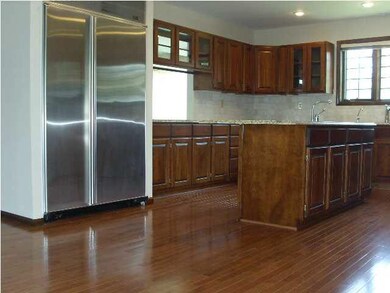 Kitchen area looks through to formal dining