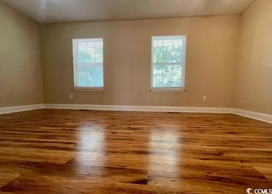 Unfurnished room with wood finished floors, health