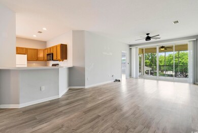 Unfurnished living room with baseboards, a ceiling fan, wood finished floors, and recessed lighting