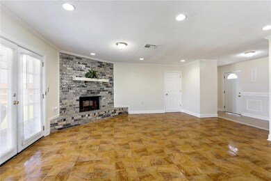 Spacious living with doors to the patio/backyard