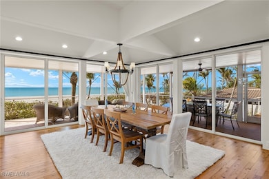 Dining room featuring a notable chandelier, a beac