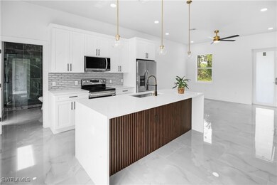 Kitchen featuring appliances with stainless steel